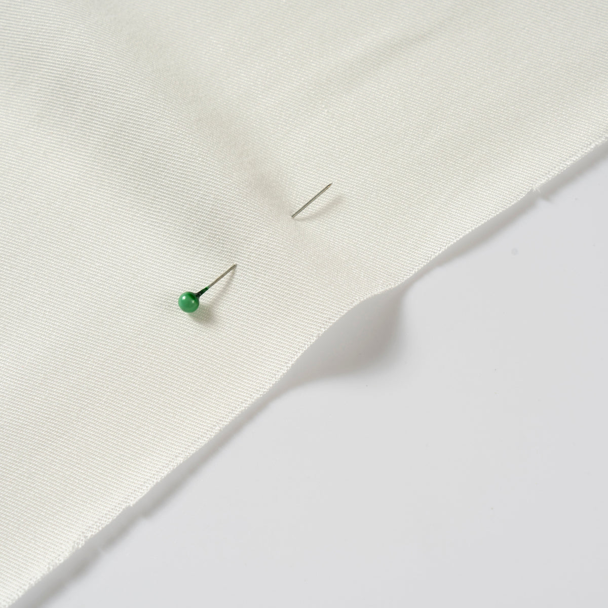 White rayon woven fabric showing a clean textile surface for material sourcing