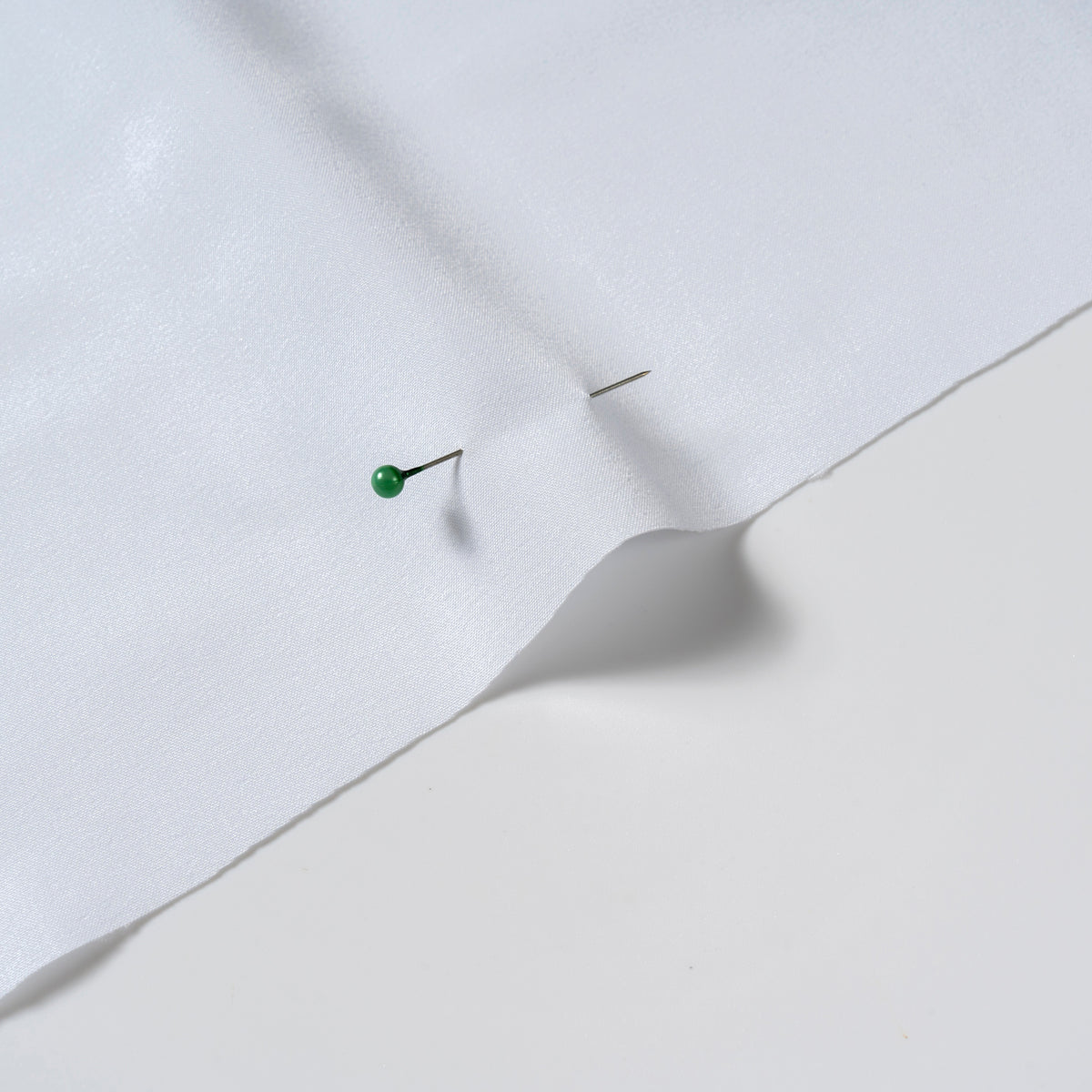 White polyester woven fabric showing a clean, traceable textile material surface