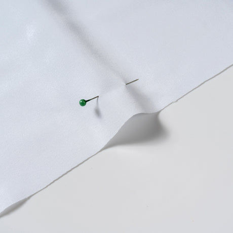 White polyester woven fabric showing a clean, traceable textile material surface