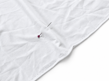 Close-up of a single white Light Double Brushed Poly fabric base with a smooth brushed surface